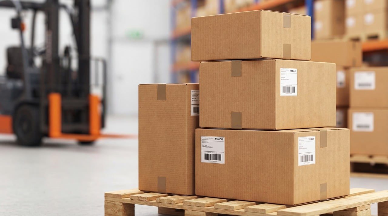 Stacked moving boxes on a pallet in a warehouse
